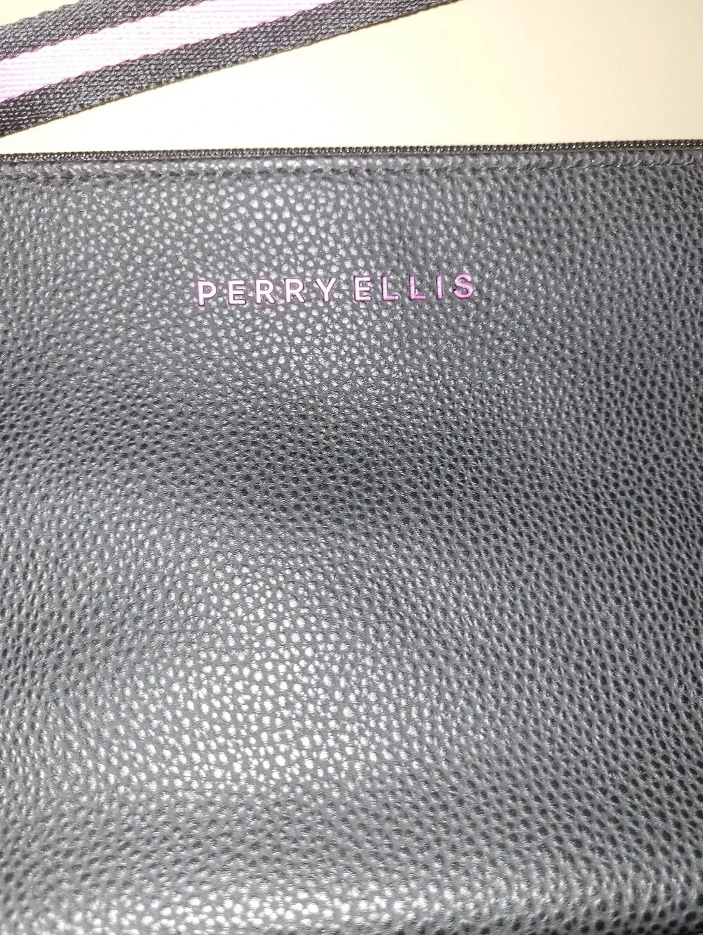 NWT - Perry Ellis Black Wristlet with Pink Trim.